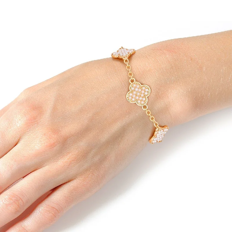 Women's ruby bangles-Timeless Grace: Pearl-Adorned Quatrefoil Chain Bracelet in Gold