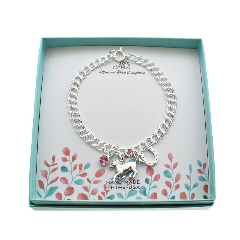 Women's seasonal bangles-Horse Charm Bracelet in Sterling Silver and Accented by a Horseshoe and a Crystal Birthstone